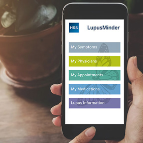 Photo of mobile phone with Lupus Minder app.