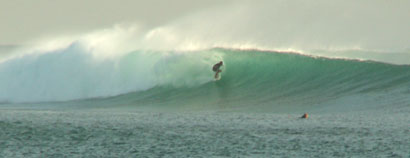 Photo of John surfing