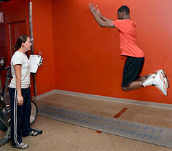 A student from Curtis H.S. in Staten Island amazes with his broad jump. 