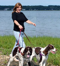 Photo of Julie walking her dogs.