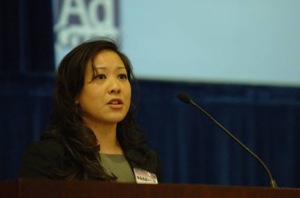 Photo of LANtern founder Karen Ng speaking at a luncheon.