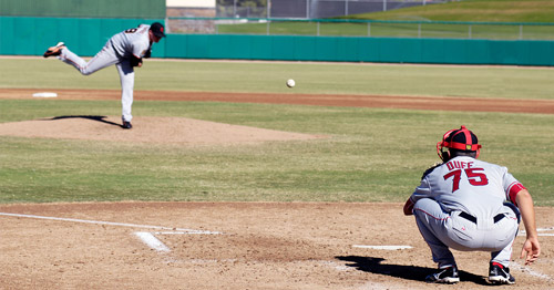 A baseball pitcher throwing.