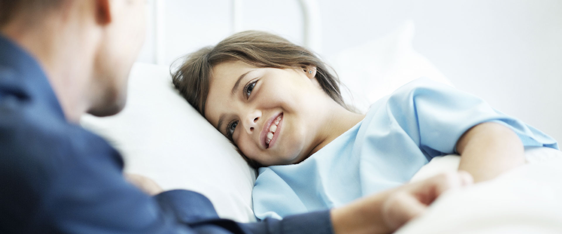 Image - smiling child in hospital bed