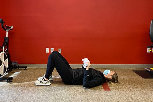 supine floor chest press end position