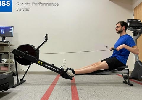 photo of aaron karp pulling handle to chest