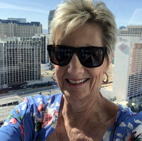 Senior woman taking a selfie from a rooftop