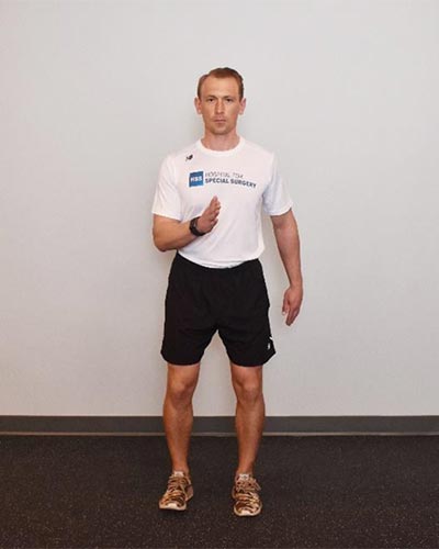 man demonstrating lateral lunges
