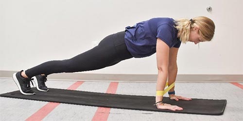 woman demonstrating push up exercise
