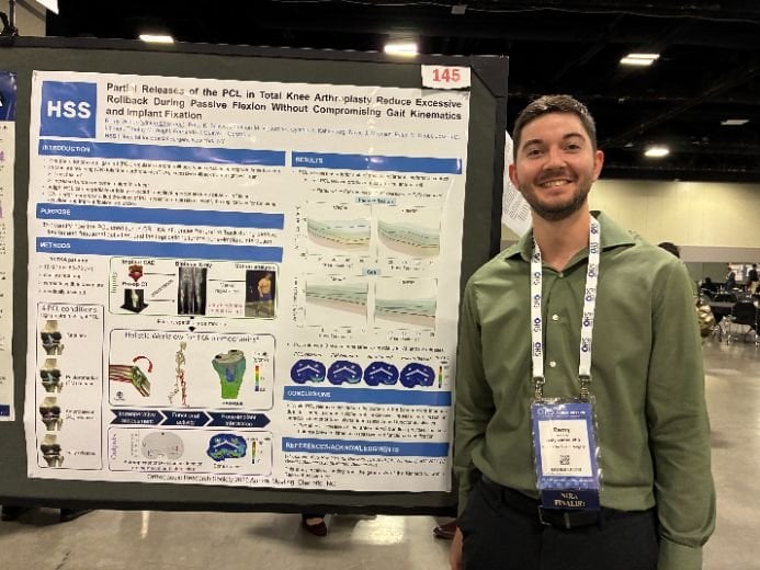 Postdoctoral fellow Remy Winter presenting his poster evaluating the effect of PCL release on femoral rollback in TKA