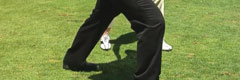 Golfer doing a calf stretch