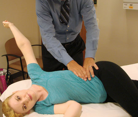 Photo of side-lying stretch for patients with lower back pain