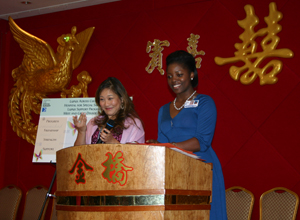 Photo of Karen Ng and Jillian Rose welcoming the group to the banquet
