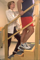 Patient doing exercises while supervised by a Physical Therapist