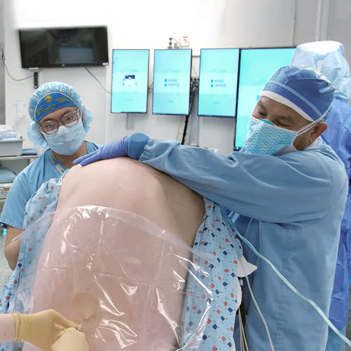A doctor applying spinal anesthesia for orthopedic surgery.