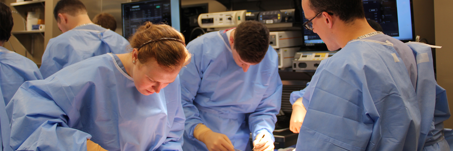 Banner image of residents working in the Bioskills Educational Laboratory