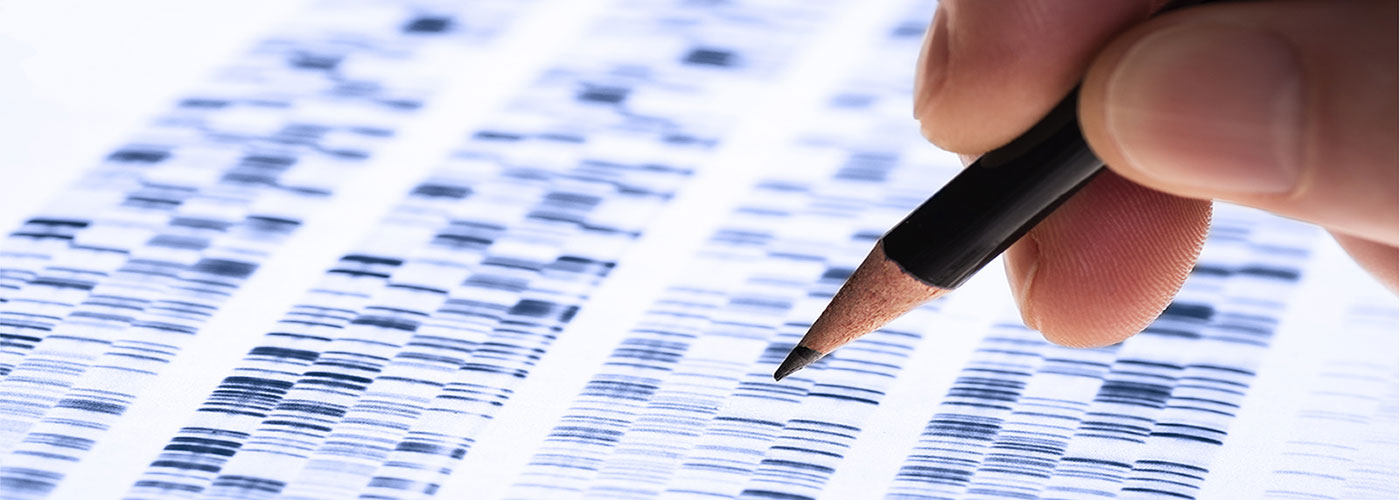 Banner image of a scientist analyzing DNA gel.