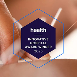 Health.com Innovative Hospital Award Winner 2023. Hands doing acupuncture in the background.