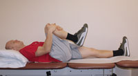 Thumbnail photo of knee to chest exercise
