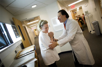 Dr. Steven Haas with a patient.