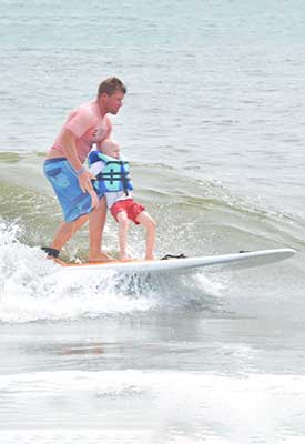 Photo of a child surfing.