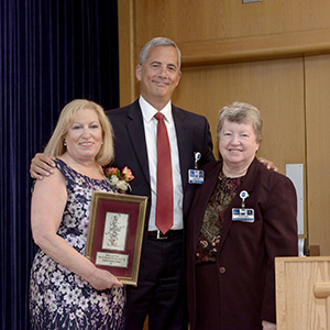 Ann Bienstock receiving wholeness of life award