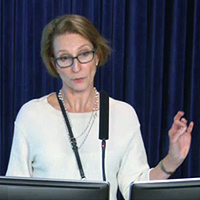 Photo of Dr. Vivian Bykerk at the lectern.