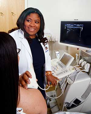 Image - Dr. Nwawka scanning a patient.