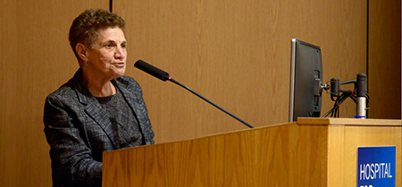 photo of public and patient education lecturer at podium