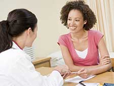 woman talking to doctor