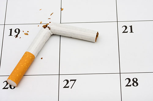 Image of a broken cigarette on a calendar.