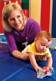 Pediatric physical therapist Magdalena Oledzka, PT, MBA, PCS, works with a child