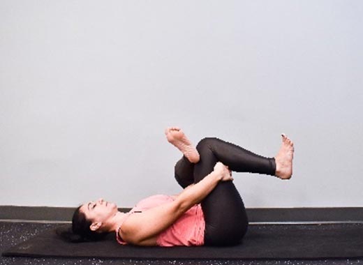 photo of cara demonstrating Figure-four stretch