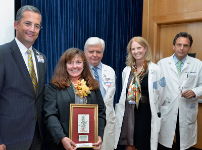 Image - Mary Ellen Zullo accepting wholeness of life award.