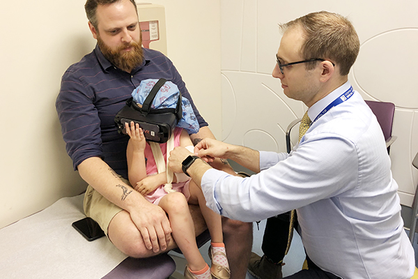 child wearing VR goggles at physician office