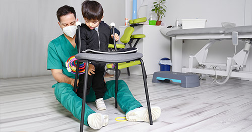 Child with cerebral palsy getting physical therapy.