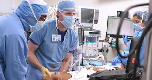 An anesthesiologist applying regional anesthesia during orthopedic surgery.