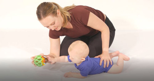 An HSS pediatric occupational therapist working with an infant.