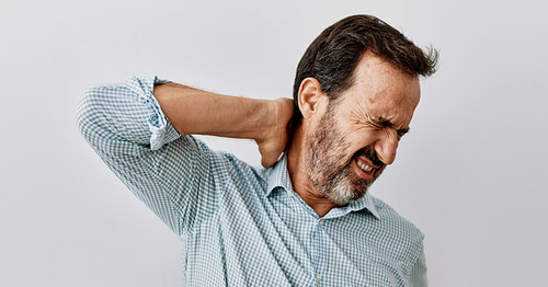 A middle-aged man with neck pain.