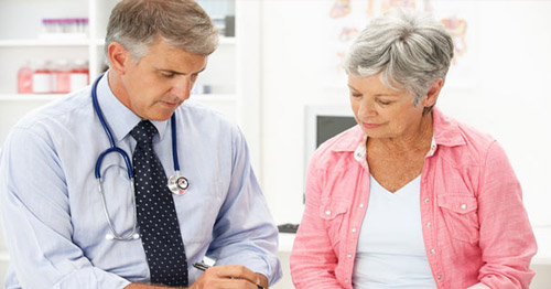 A doctor speaking with a patient. 
