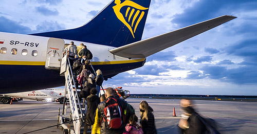 Passengers boarding a commercial airliner.