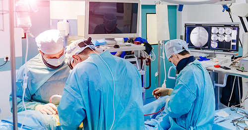 Spine surgeons working in an OR.