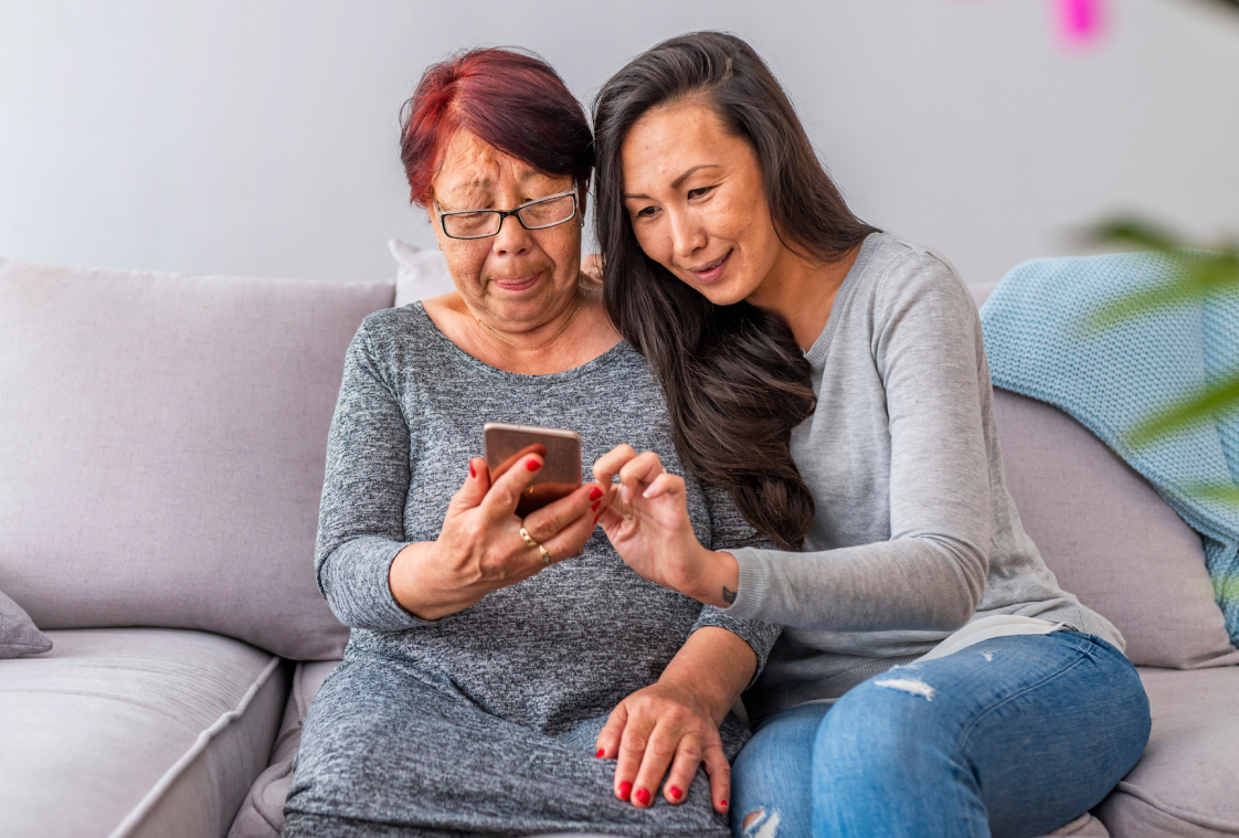 photo of mom and daughter looking at phone
